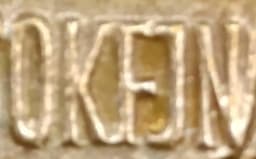 Napis OKJFN - Ogólnopolski Komitet Frontu Jedności Narodu